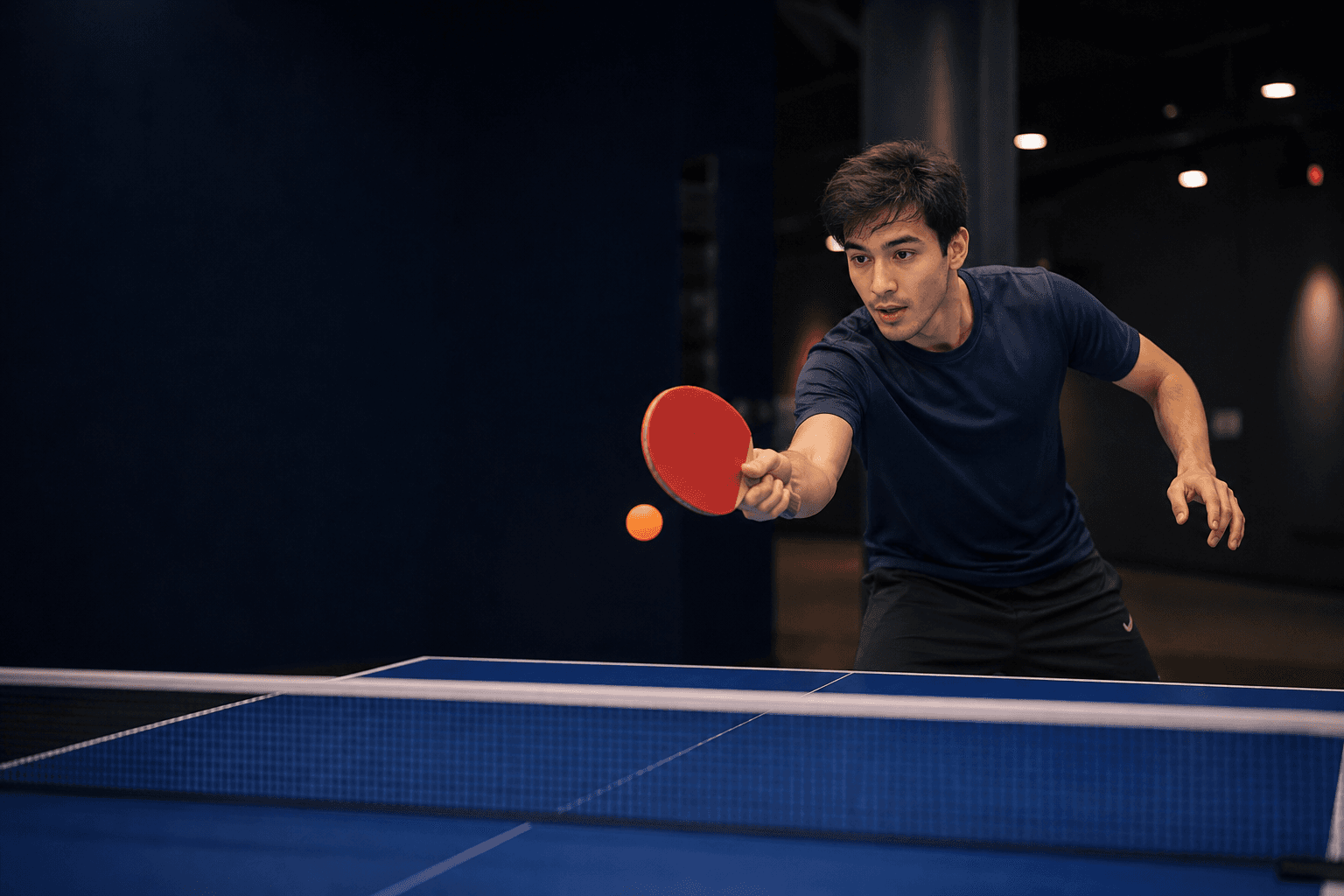 Table tennis player preparing to return a shot